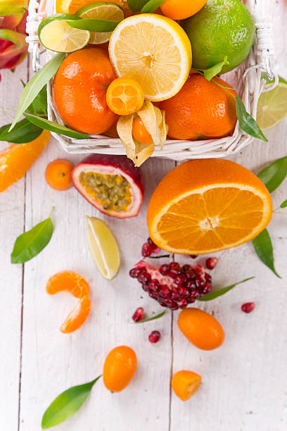 istock Fresh citruses on old wooden table 521706382