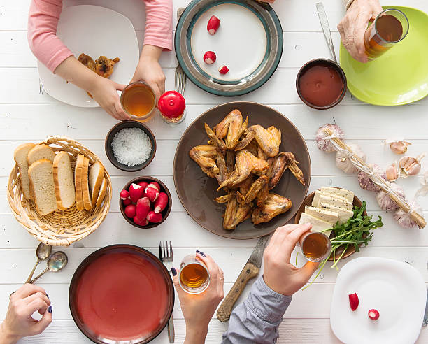 istock family dinner with roasted chicken wings 521707446