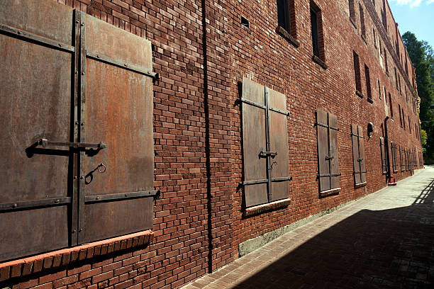 Vintage brick warehouse with iron doors in historic Placerville, California. Horizontal.