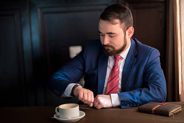 istock businessman looks at the clock 521707832