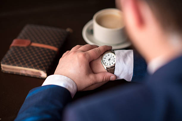 istock businessman looks at the clock 521708498