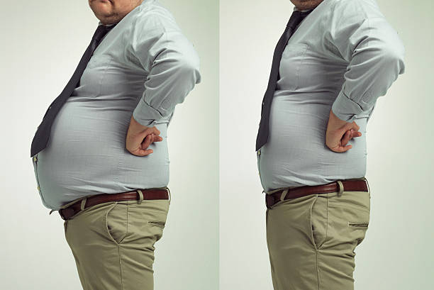 parece bom para trabalhar! - overweight dieting men unhealthy eating - fotografias e filmes do acervo