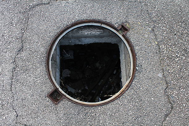 Street hole dangerous hole in the street, missing manhole manhole stock pictures, royalty-free photos & images