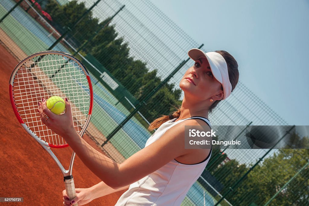 Getting Ready To Serve Female Getting Ready To Serve On A Tennis Court Active Lifestyle Stock Photo