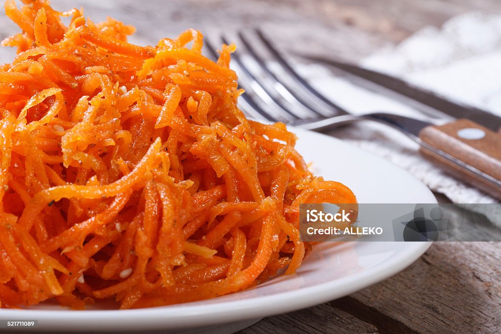 grated carrots with spices Korean. macro grated carrots with spices Korean closeup. macro Appetizer Stock Photo