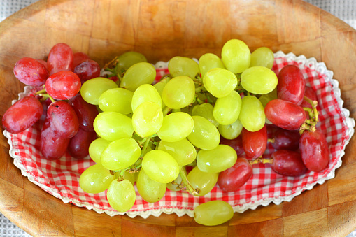 Natural red and green grapes in country style