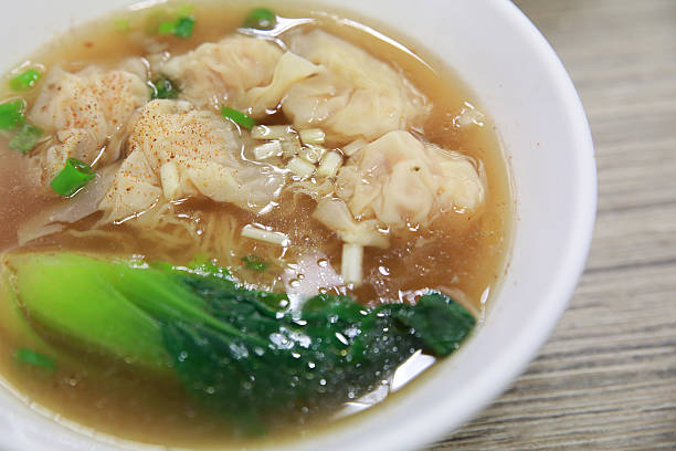 istock Tasty wonton soup and noodle 521712573