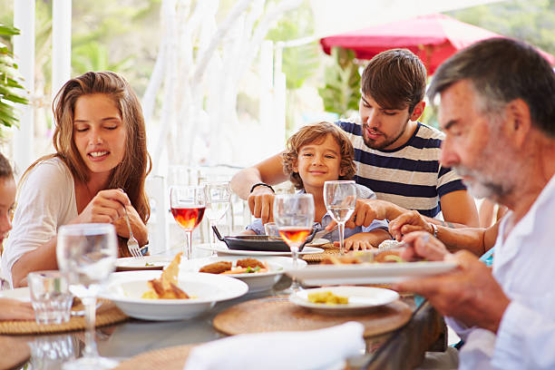 istock Multi Generation Family Enjoying Meal In Restaurant 521713655