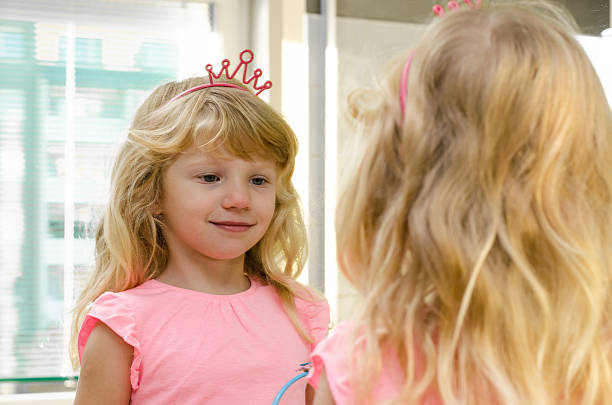 istock blond girl in mirror 521713721