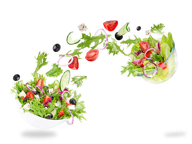 istock Fresh salad with flying vegetables ingredients 521714165