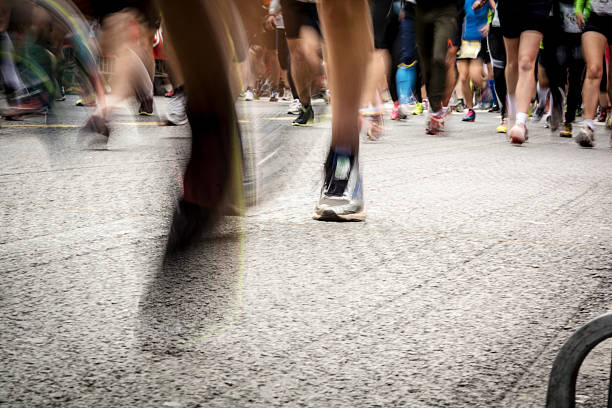 istock Runners in city marathon (motion blurred) 521714579