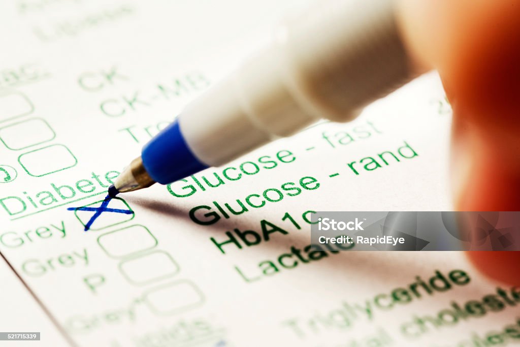 Glucose test marked in pen on medical form A pen marks a medical form used for ordering blood tests; featured here is the glucose test for diagosing diabetes. Blood Test Stock Photo