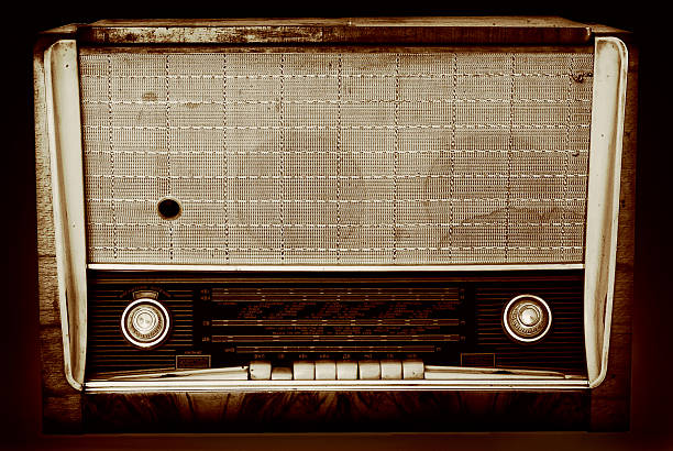 istock Old radio isolated on a dark background 521723597