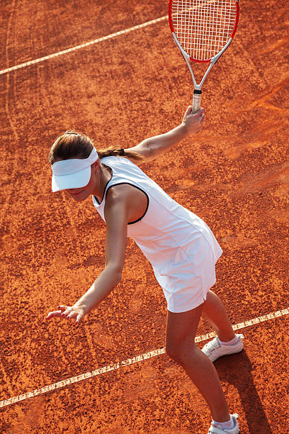 istock Pretty Female Tennis Player Playing a Match 521723953