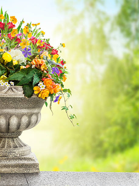 Antique vase with flowers in garden