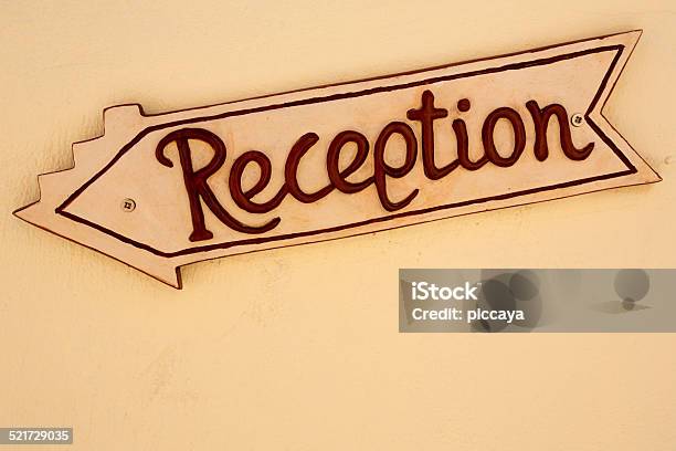 Yellow Reception Sign Board In A Hotel Stock Photo - Download Image Now - Advice, Arrival, Backgrounds