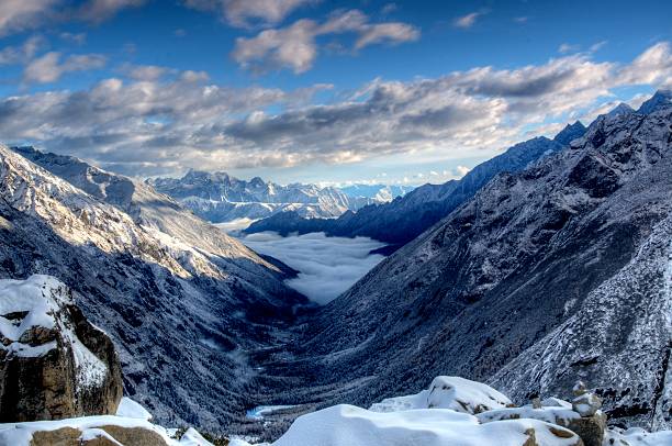 istock Clouds flow in valley - Four Girls Mountain 521729759