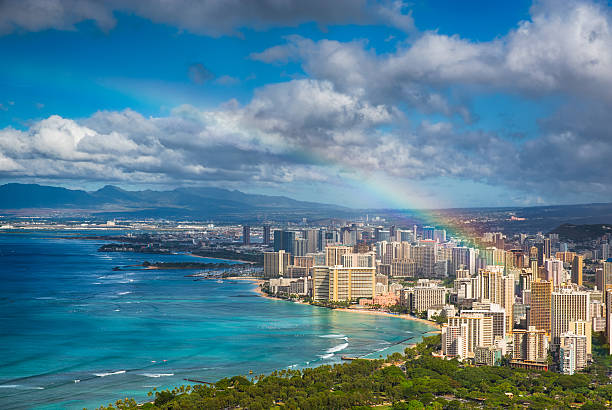 Rainbow over Hawaii Beautiful rainbow over the Hawaii skyline oahu stock pictures, royalty-free photos & images