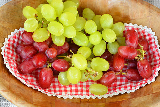 istock Natural red and green grapes in country style 521746209