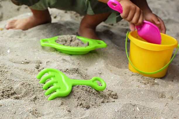 istock Children's beach toys on sand 521746969