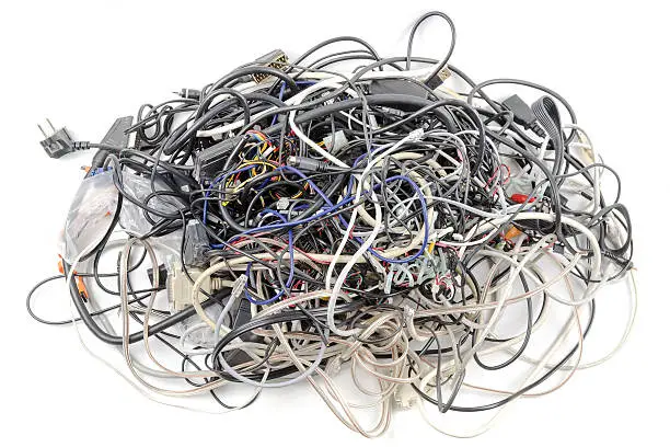 Photo of Interwoven tangle of wires on a white background