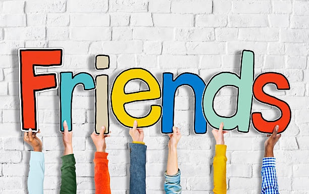 istock Group of Hands Holding Word Friends 521757153