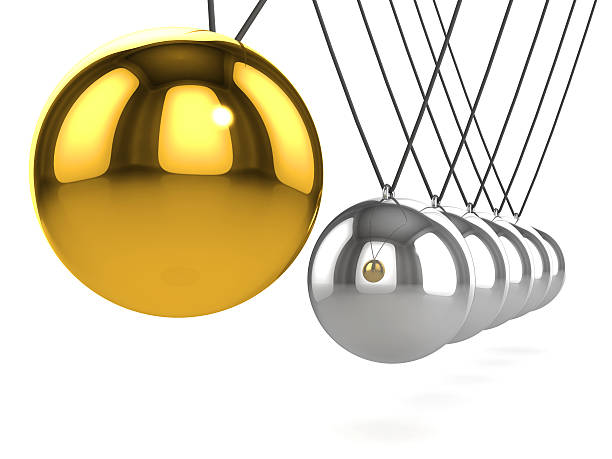 istock 3d Newtons cradle with gold ball close up 521757641
