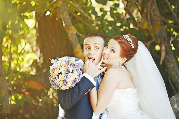 istock Newly wed couple holding hands. 521758831