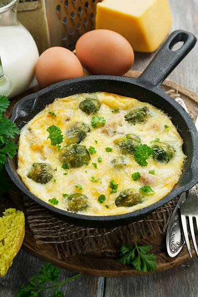 Casserole with brussels sprouts and cheese in a frying pan stock photo