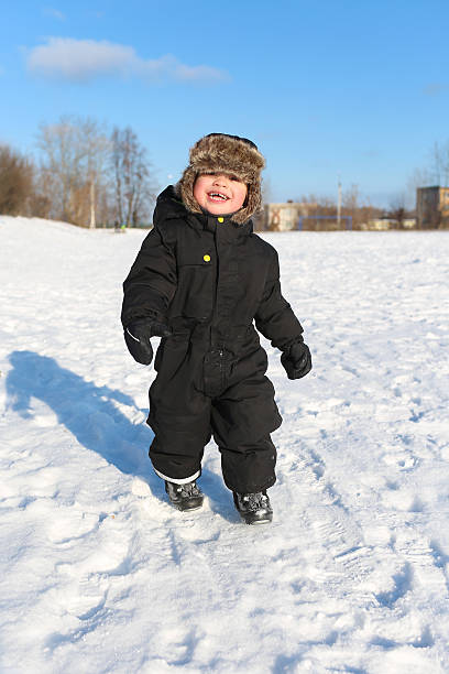 istock happy 2 year toddler walking in winter 521760501