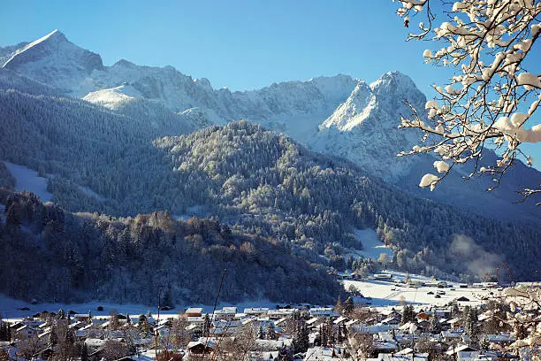 Wonderful panoramic shot of Garmisch-Partenkirchen and the German Alps on an amazing day in winter. 