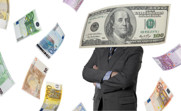 istock Financial executive with euro and dollar bills 521761021