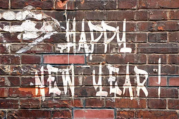 Happy new Year on a brick wall, street-art style. 