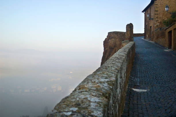 The walls of Orvieto, Italy. Over looking the Umbrian hills engulfed in early morning fog.
