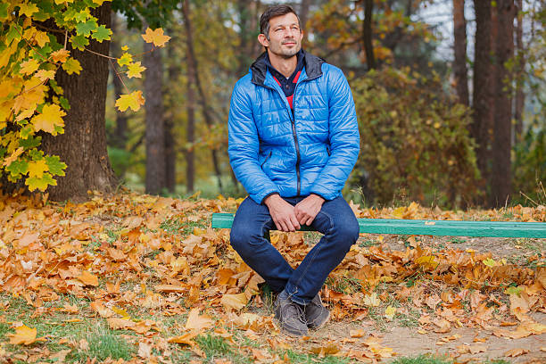 istock Man in the autumn park 521775281