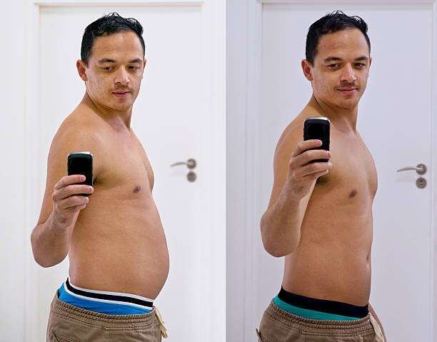 So long gut, hello six pack! Shot of a handsome young man taking a selfie before and after his diet before and after weight loss man stock pictures, royalty-free photos & images