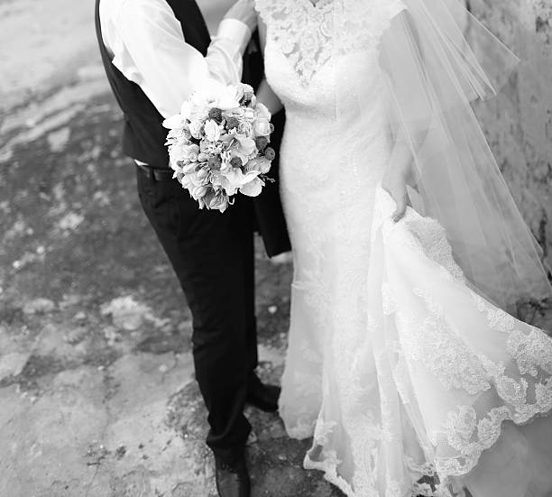 istock Newlywed couple holding hands. 521777319