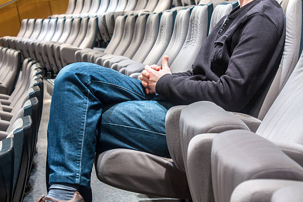 istock Single man waiting in amphitheatre 521778099