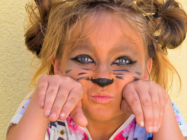 The girl  ten years embellished cat face stock photo