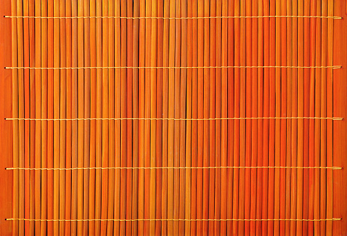 Orange bamboo slatted background.