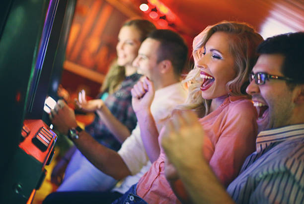 istock Group of people playing slots in casino. 521792971
