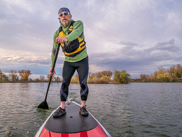 stand up paddling on a lake