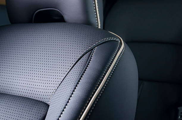 Leather car seats  detail with focus on stitch stock photo
