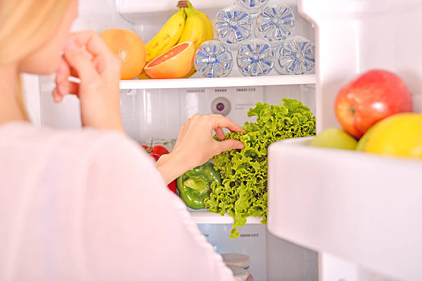 istock Young woman searching ingredients for cooking 521797372