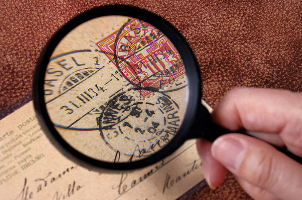 research on philately with magnifier