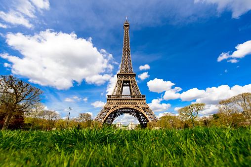 Paris, France - April 14, 2018: The Eiffel Tower is a wrought-iron lattice tower. It is considered one of the most recognizable structures in the entire world. It is named after Gustave Eiffel, the engineer of the tower. Constructed from 1887 - 1889 it stands at 1,063 feet high and was built for the 1889 World's Fair.