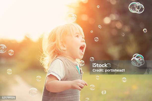 Little Boy And Soap Bubbles Stock Photo - Download Image Now - Toddler,  Playing, Outdoors - iStock