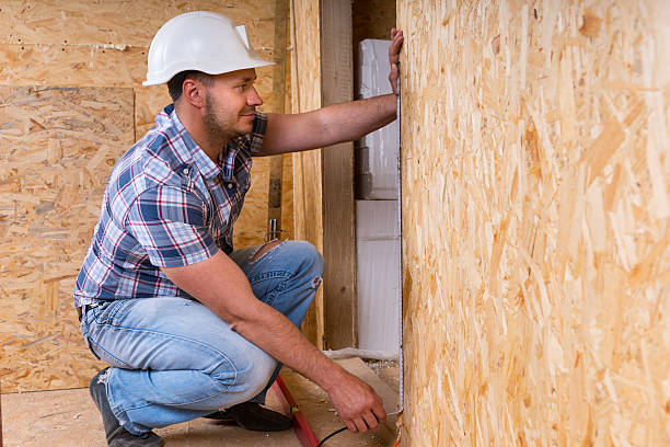 istock Builder Measuring Door Frame In Unfinished Home 521800394
