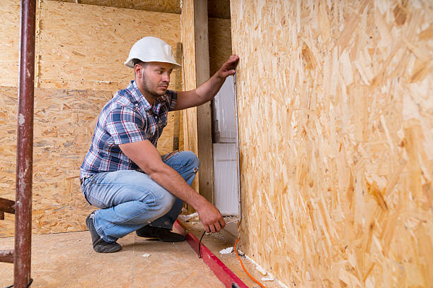istock Builder Measuring Door Frame In Unfinished Home 521800848