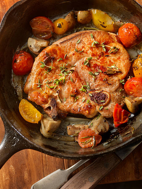 istock Pork Loin Chops with Tomatoes and Mushrooms 521800872